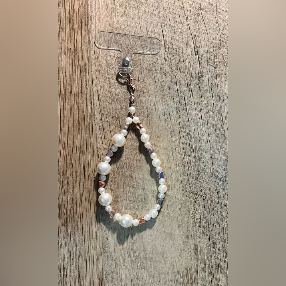 Beaded phone dangle/keychain. Fits up to 4 fingers, but not whole wrist.